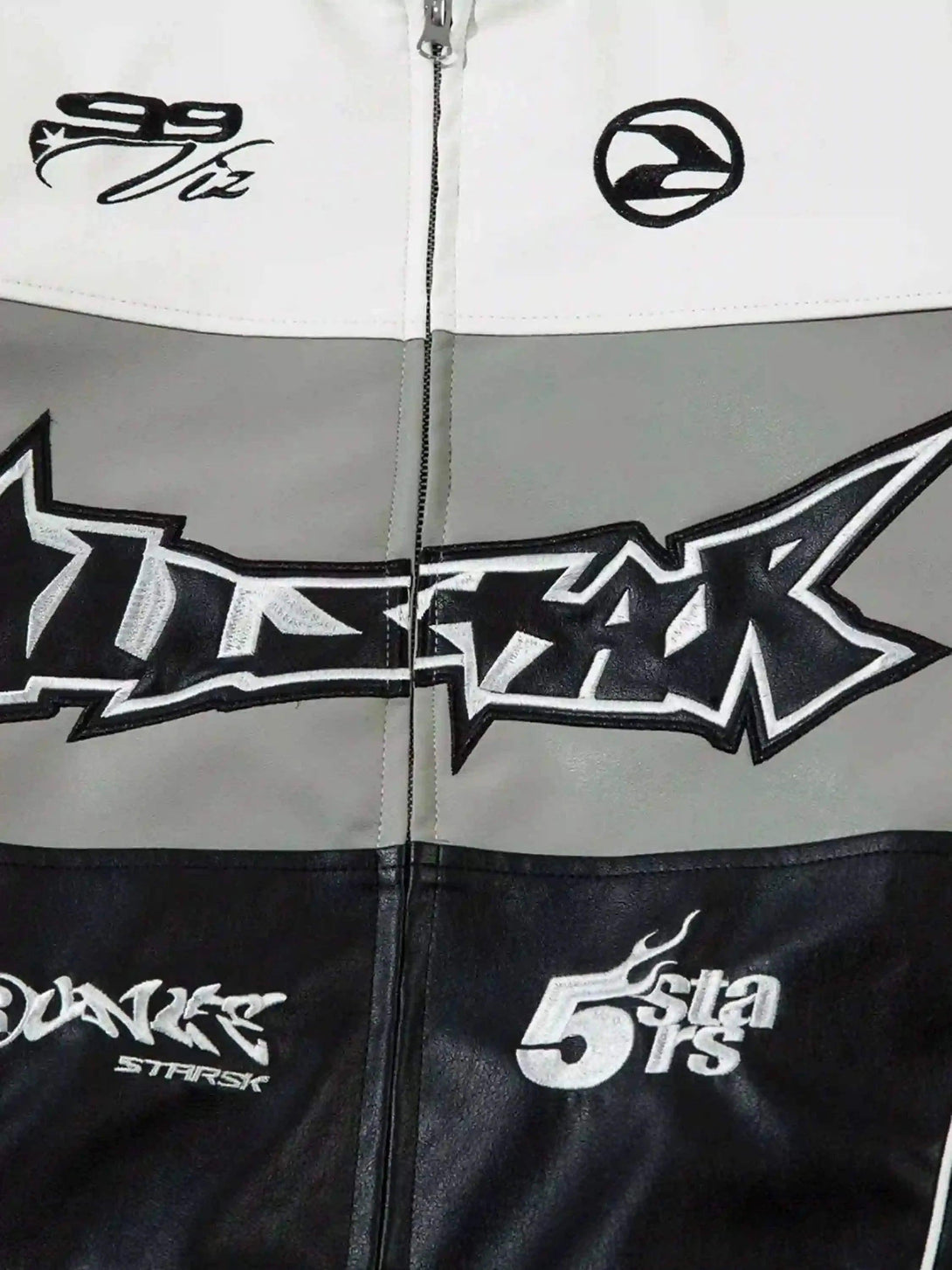 Detailed view of TALISHKO's PU motorcycle jacket, focusing on street style graphics and logos.