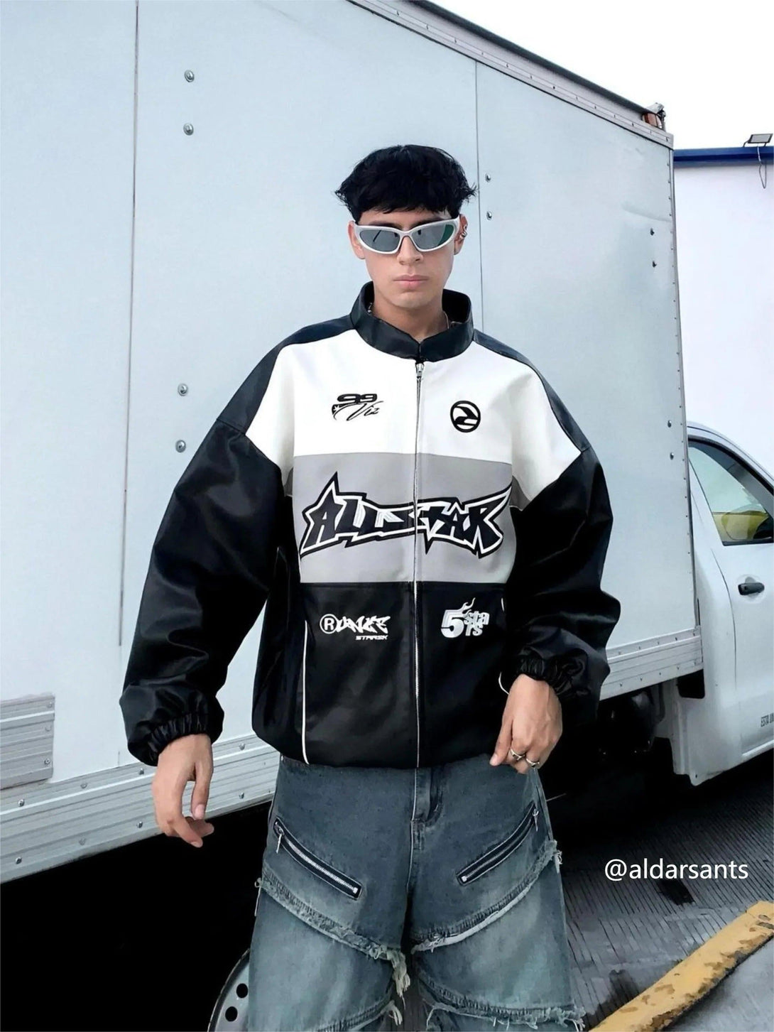 Model wearing TALISHKO's hip-hop street style PU motorcycle jacket with bold graphics.