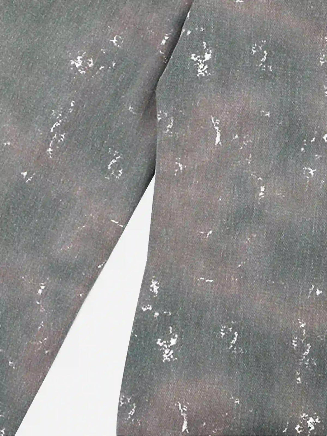 A detailed look at TALISHKO's ink-splashed jeans texture, highlighting the Y2K hip-hop style.
