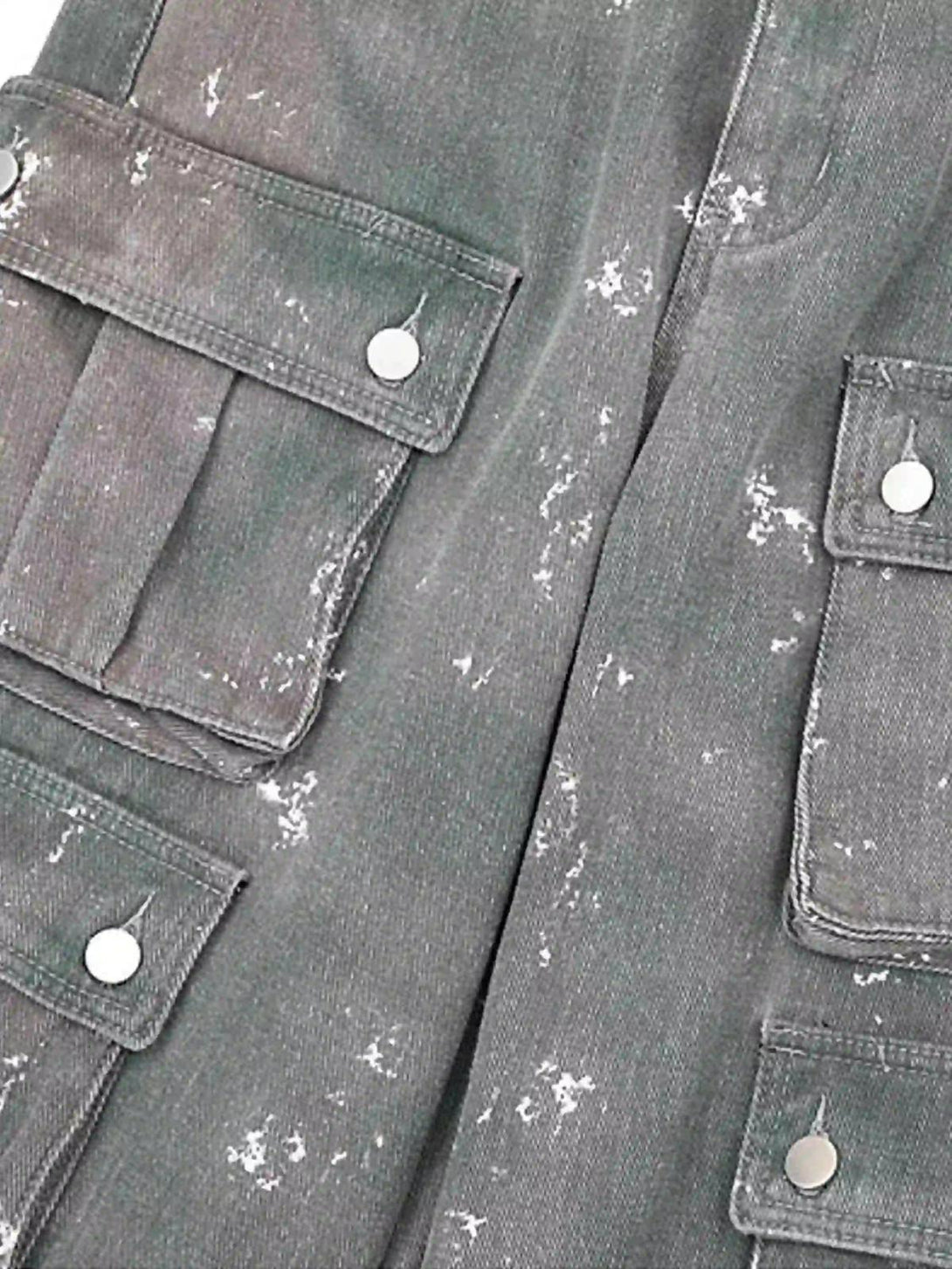 A tight crop highlighting TALISHKO's ink-splashed cargo pockets, revealing unique texture details.