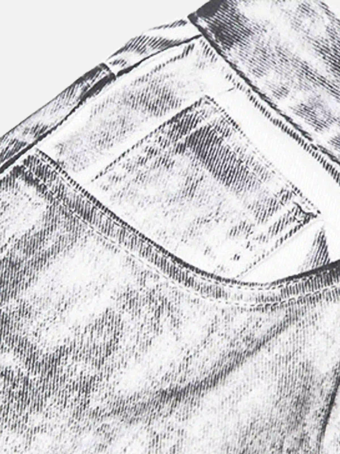 A detailed fabric and stitching view of TALISHKO's hip-hop style painted jeans, highlighting texture.