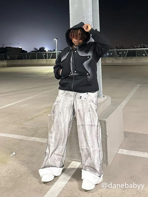 Street style vibes with TALISHKO's painted dirty jeans and hoodie ensemble, perfect for urban nights.