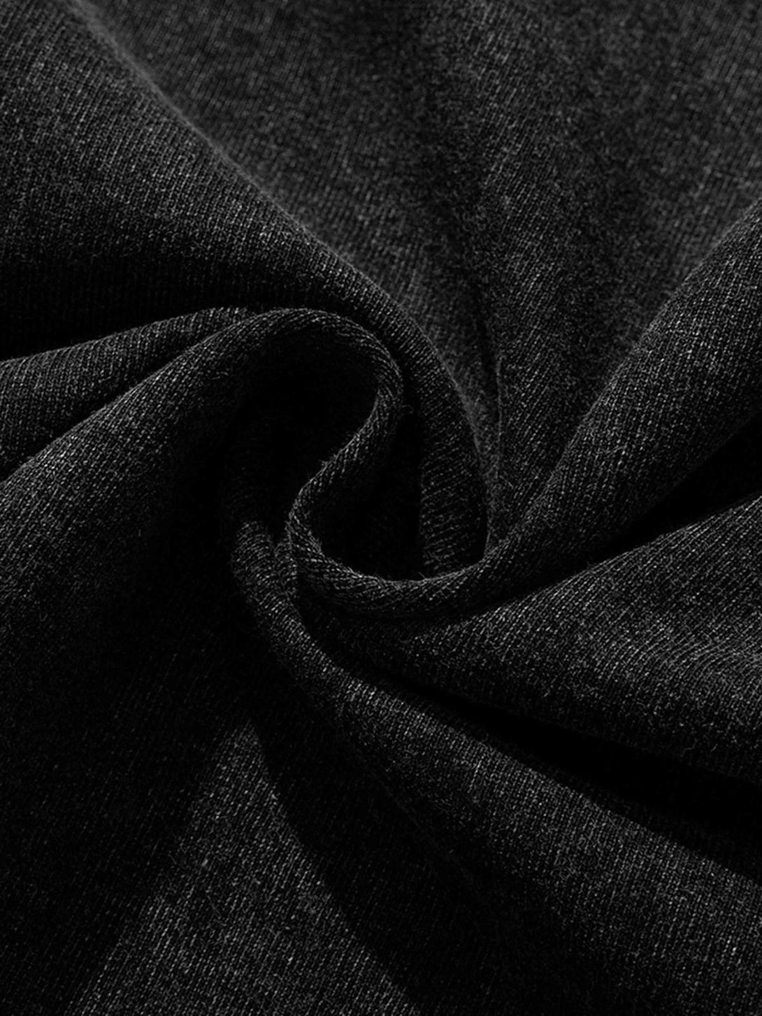 Zoomed-in texture of TALISHKO's vintage t-shirt, highlighting its rich, dark fabric.
