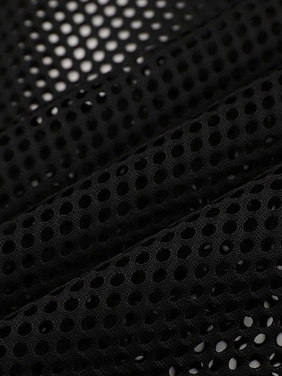 A close-up of the breathable mesh fabric on a TALISHKO vest, showcasing its airy design.