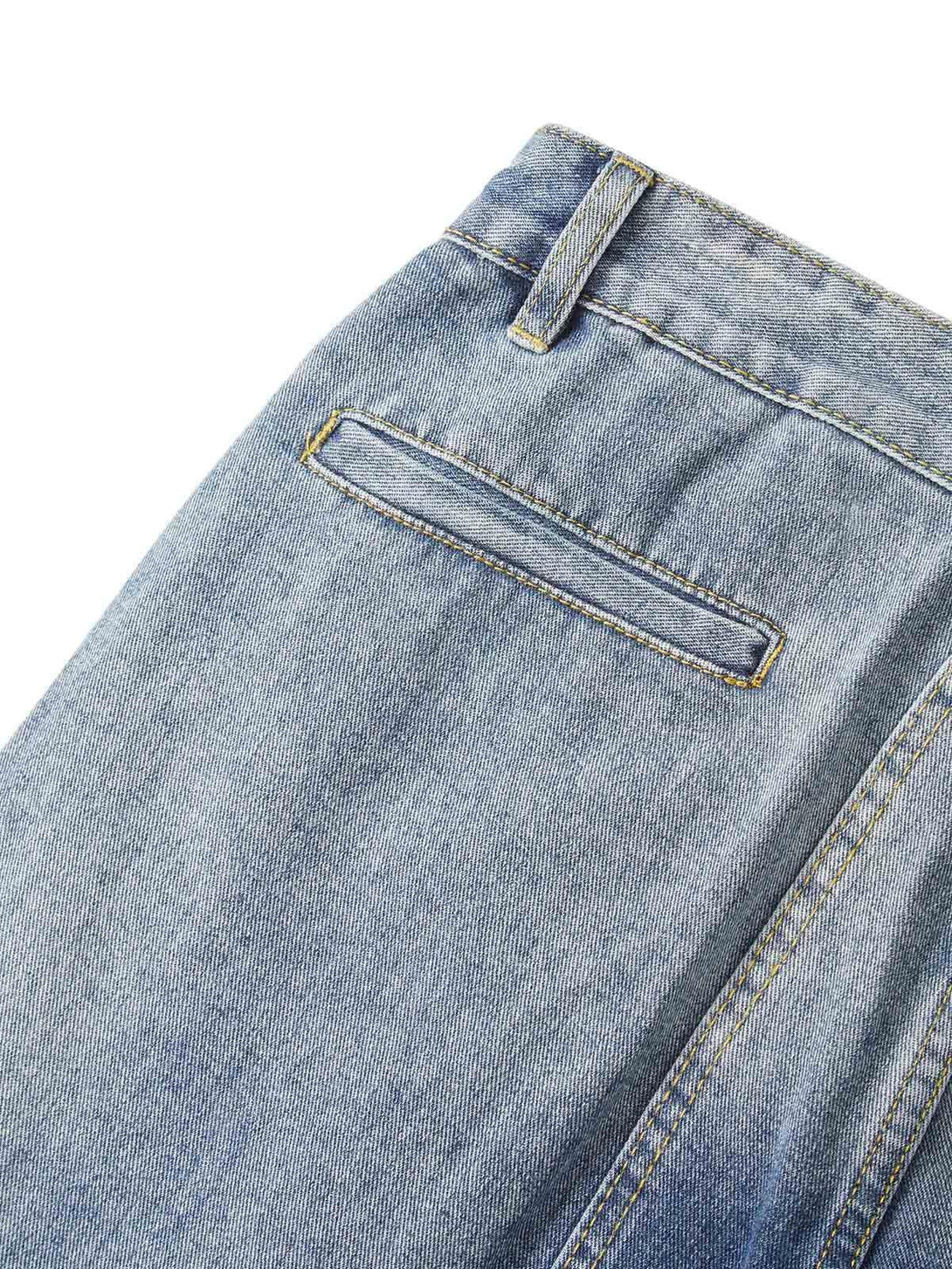 A close-up of TALISHKO cargo jeans' back pocket, highlighting the detailed stitching and texture.