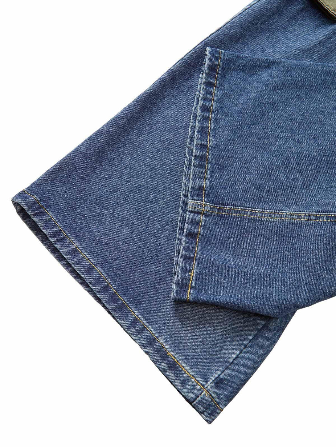 Detailed fabric and stitching of TALISHKO cargo jeans, highlighting large pocket design.