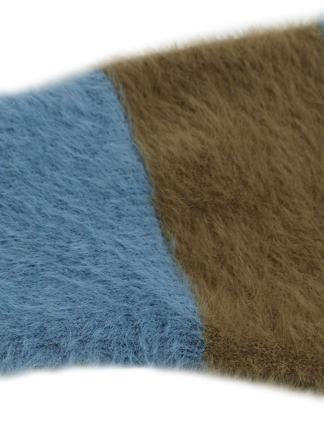 A tight crop highlighting the soft texture of TALISHKO's blue and brown knit sweater.