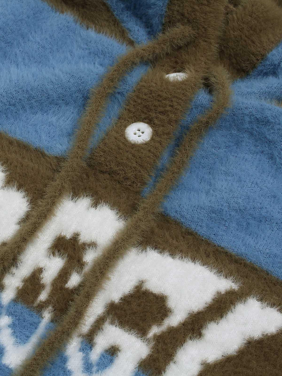 A detailed view of TALISHKO's blue and brown hooded knit sweater, highlighting its soft texture.