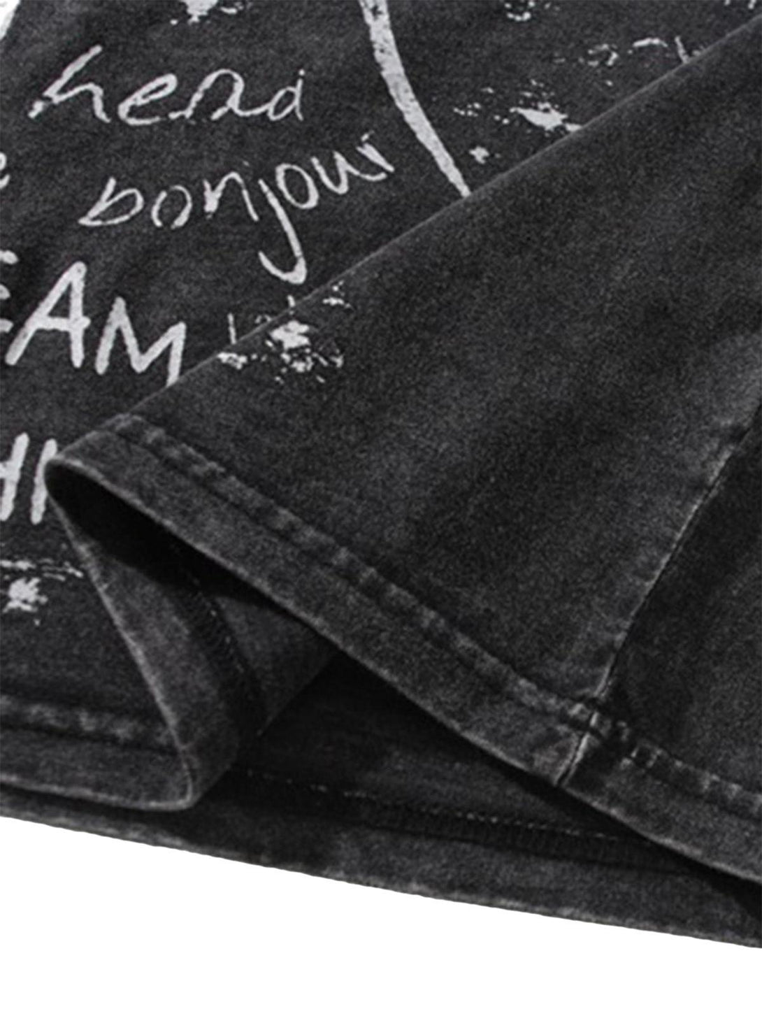 Intricate look at the graffiti-inspired text on TALISHKO's vintage vest, highlighting its edgy design.