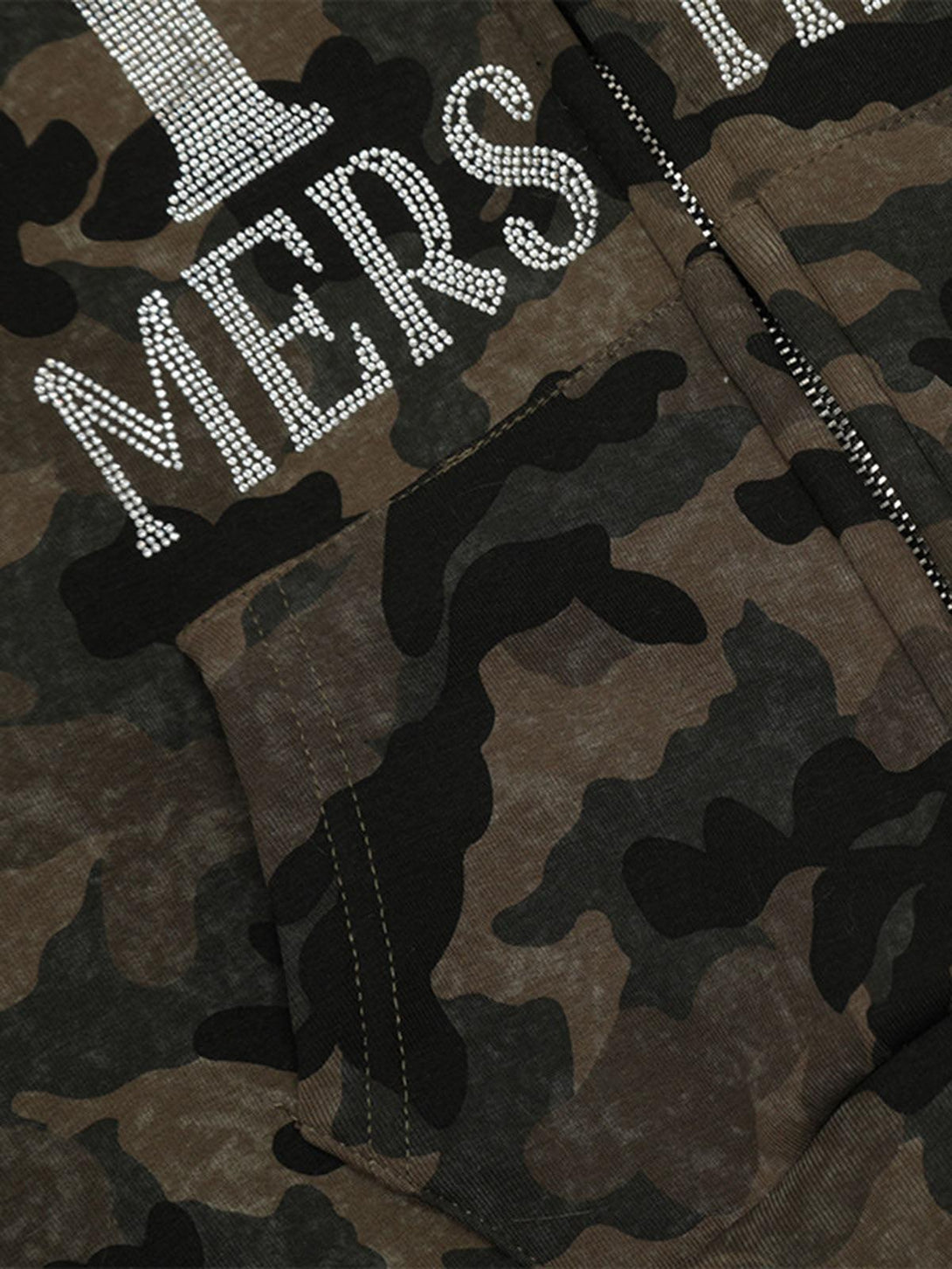 Detailed view of TALISHKO's camouflage fleece jacket with rhinestone embellishments.