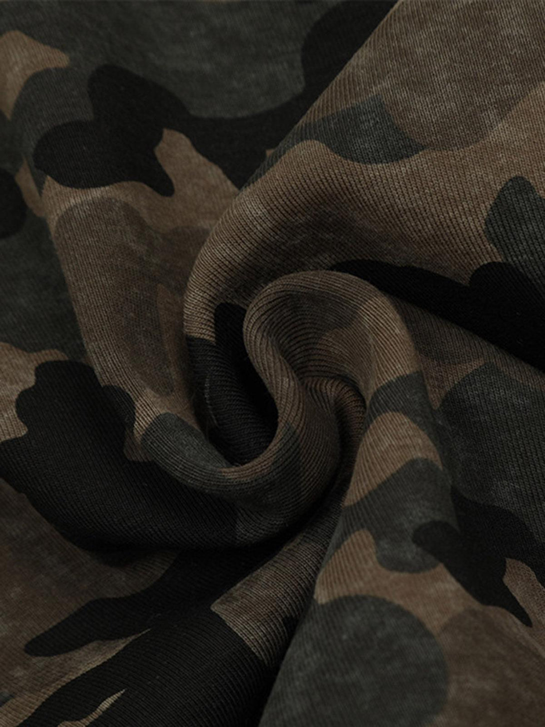 Texture and pattern showcased on TALISHKO's camouflage fleece jacket fabric.
