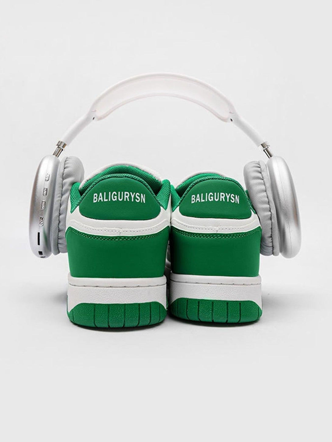 TALISHKO green and white sports board shoes paired with headphones, showcasing a modern vibe.