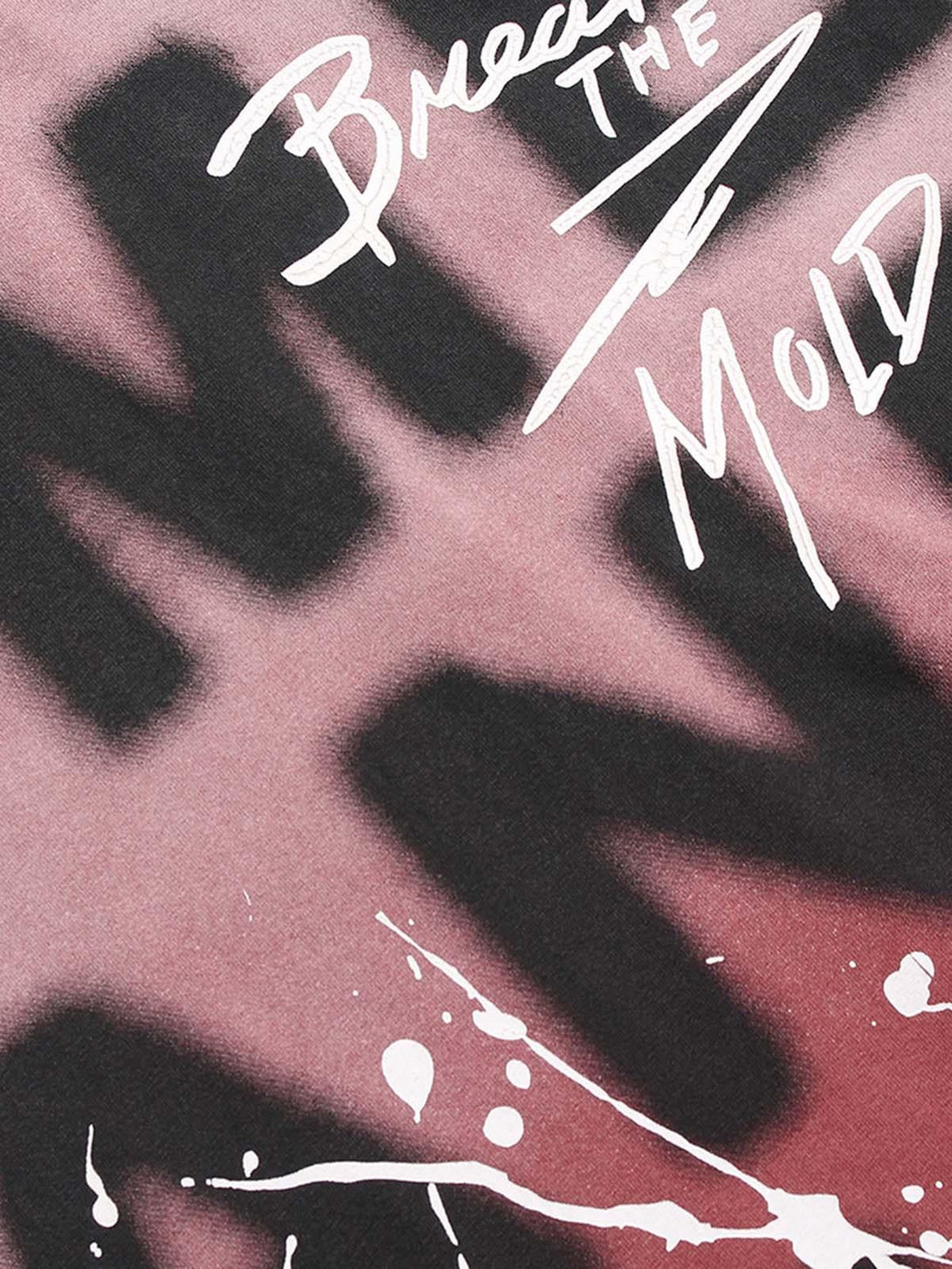 Artistic view of TALISHKO ink splash letter print T-shirt with bold typography and paint splatter.