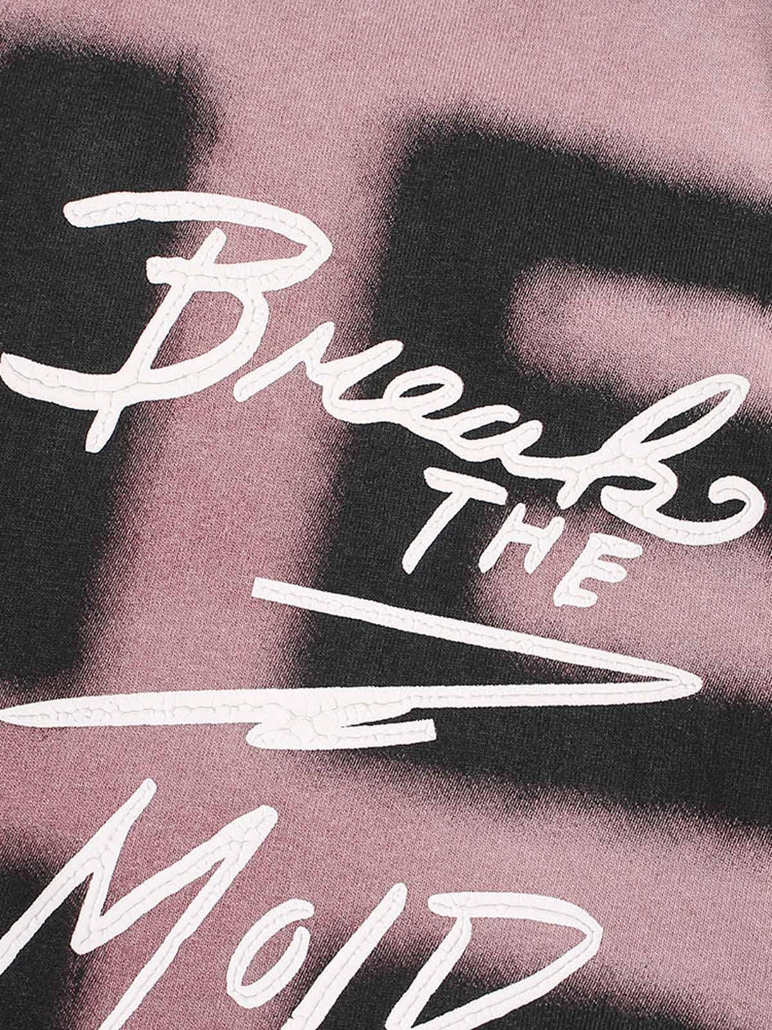 A detailed view of TALISHKO ink splash letter print T-shirt, showcasing bold typography and texture.