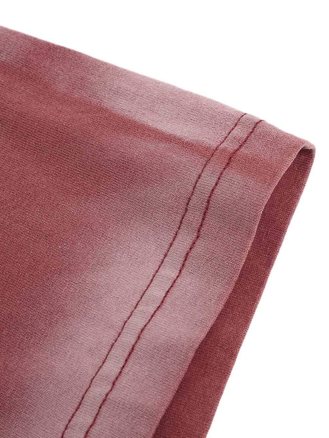 Intricate look at TALISHKO ink splash letter print T-shirt's stitching in a soft pink shade.