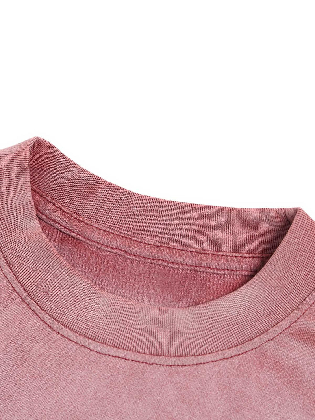 Detailed fabric and stitching of TALISHKO ink splash letter print T-shirt in a muted pink hue.