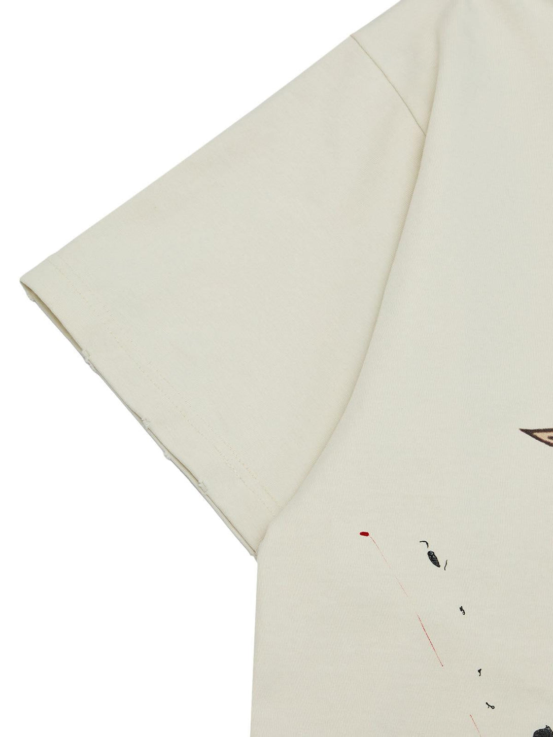 A close-up of TALISHKO T-shirt sleeve, highlighting ink-splashed design for summer vibes.