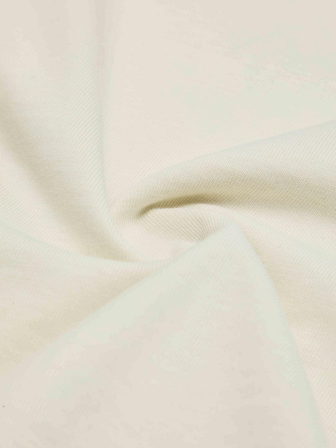 Detailed fabric and texture of a TALISHKO T-shirt, perfect for warm weather style.