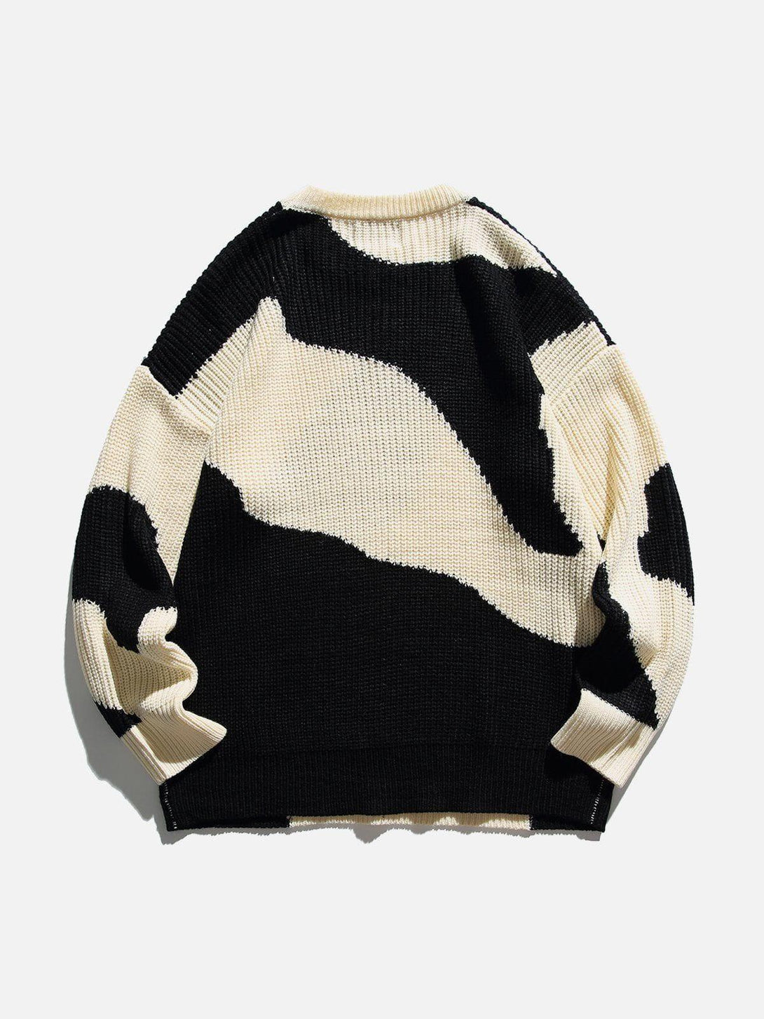 Back view of a black and white abstract sweater by TALISHKO, highlighting unique patterns.