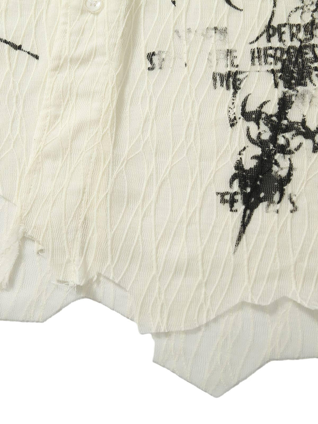 A detailed look at the irregular pleated texture and print design on this TALISHKO shirt.
