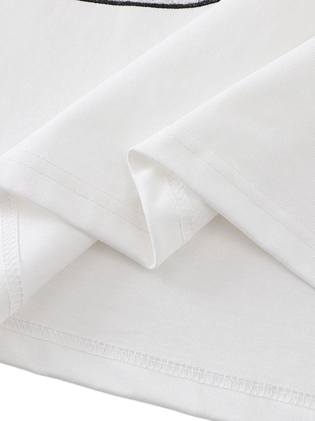 Detailed fabric and stitching of TALISHKO graphic T-shirt, highlighting quality craftsmanship.