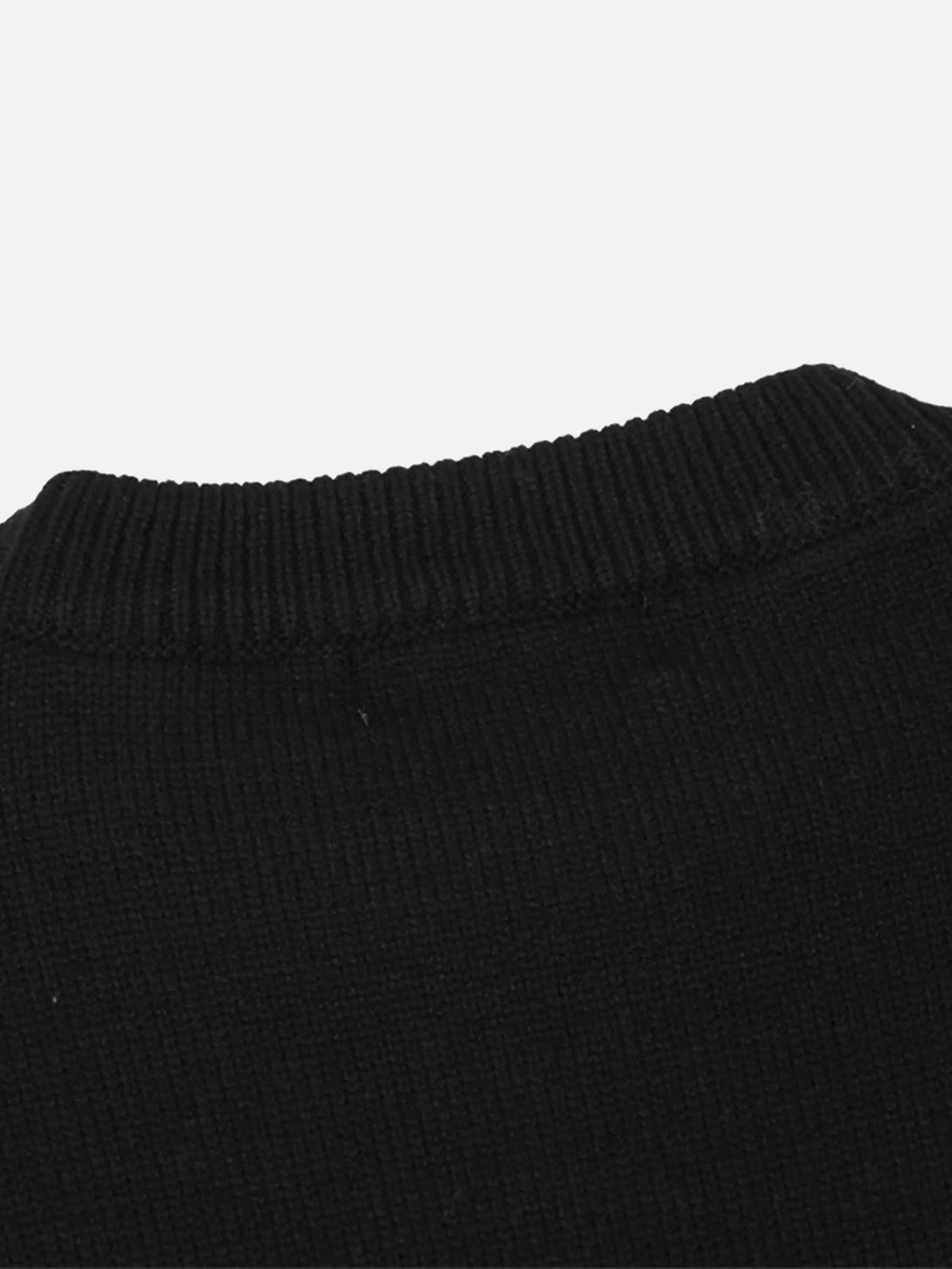 Detailed fabric and ribbed neckline of a black crewneck sweater by TALISHKO.