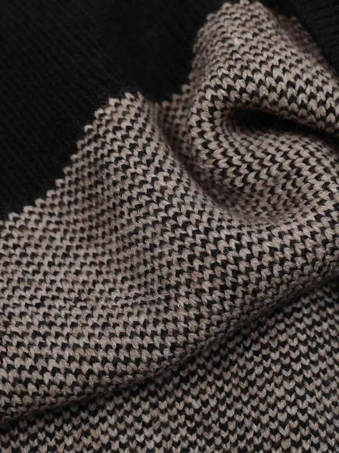 Texture and pattern showcased in TALISHKO jacquard butterfly sweater, highlighting intricate design.
