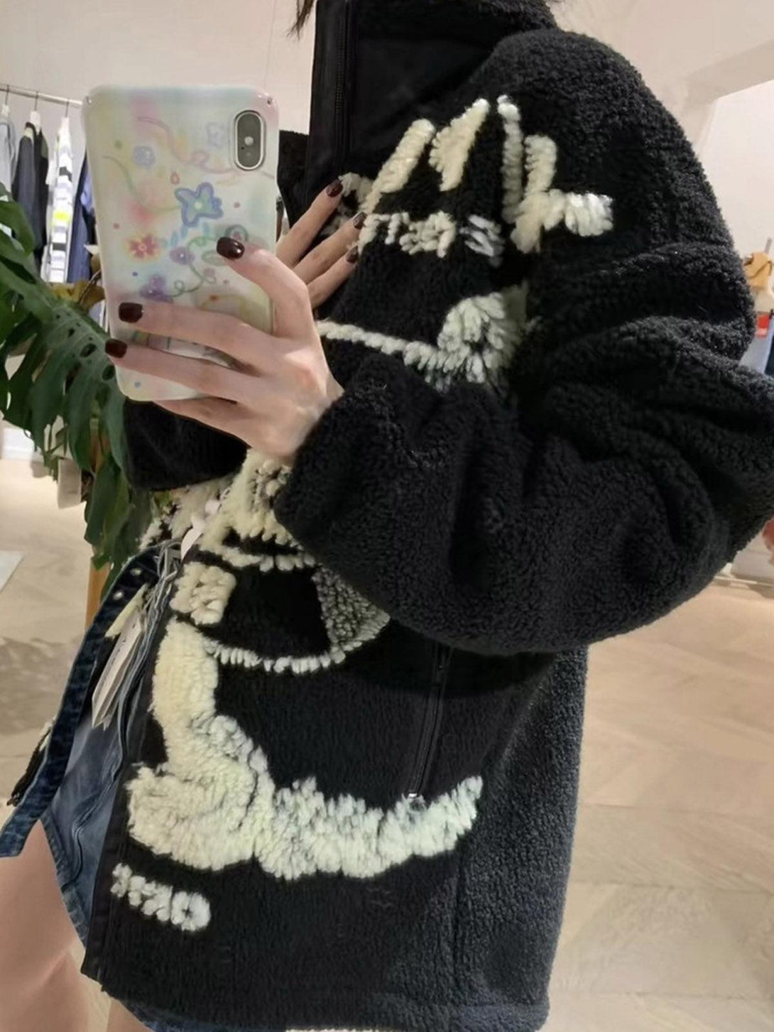 Model wearing TALISHKO sherpa jacket, featuring bold jacquard design and cozy texture.