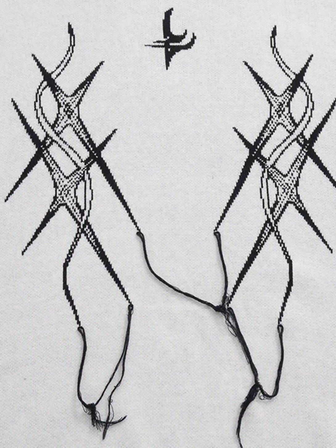 Detailed fabric and stitching of a jacquard thorns tassel sweater, crafted by TALISHKO.