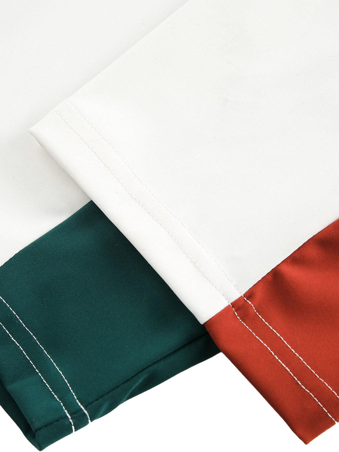 Detailed fabric and stitching on a TALISHKO jersey, highlighting contrast color design.