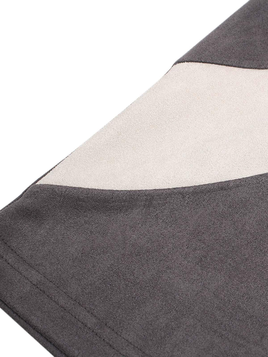 A detailed view of TALISHKO T-shirt's fabric, highlighting contrast color stitching design.
