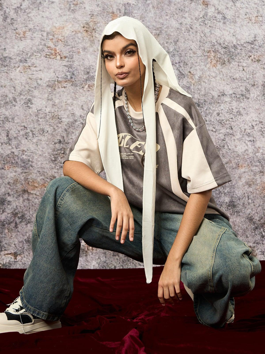 Model styled in TALISHKO's deconstructed T-shirt, showcasing unique contrast stitching.