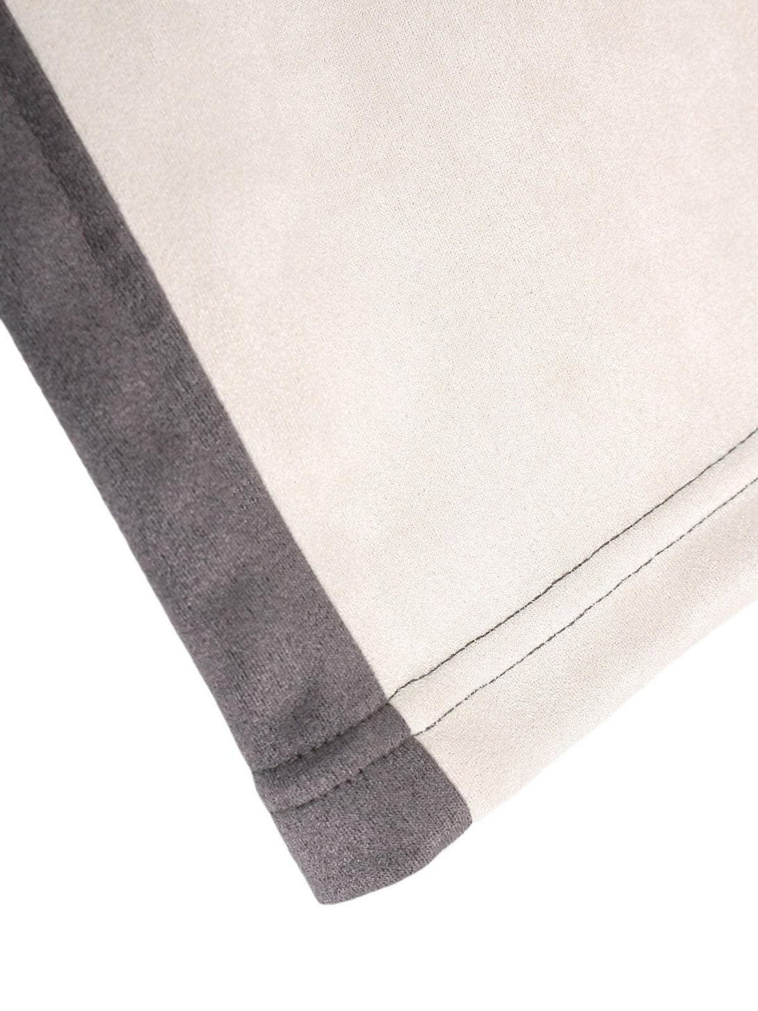 Detailed view of TALISHKO T-shirt fabric, focusing on contrast color stitching design.