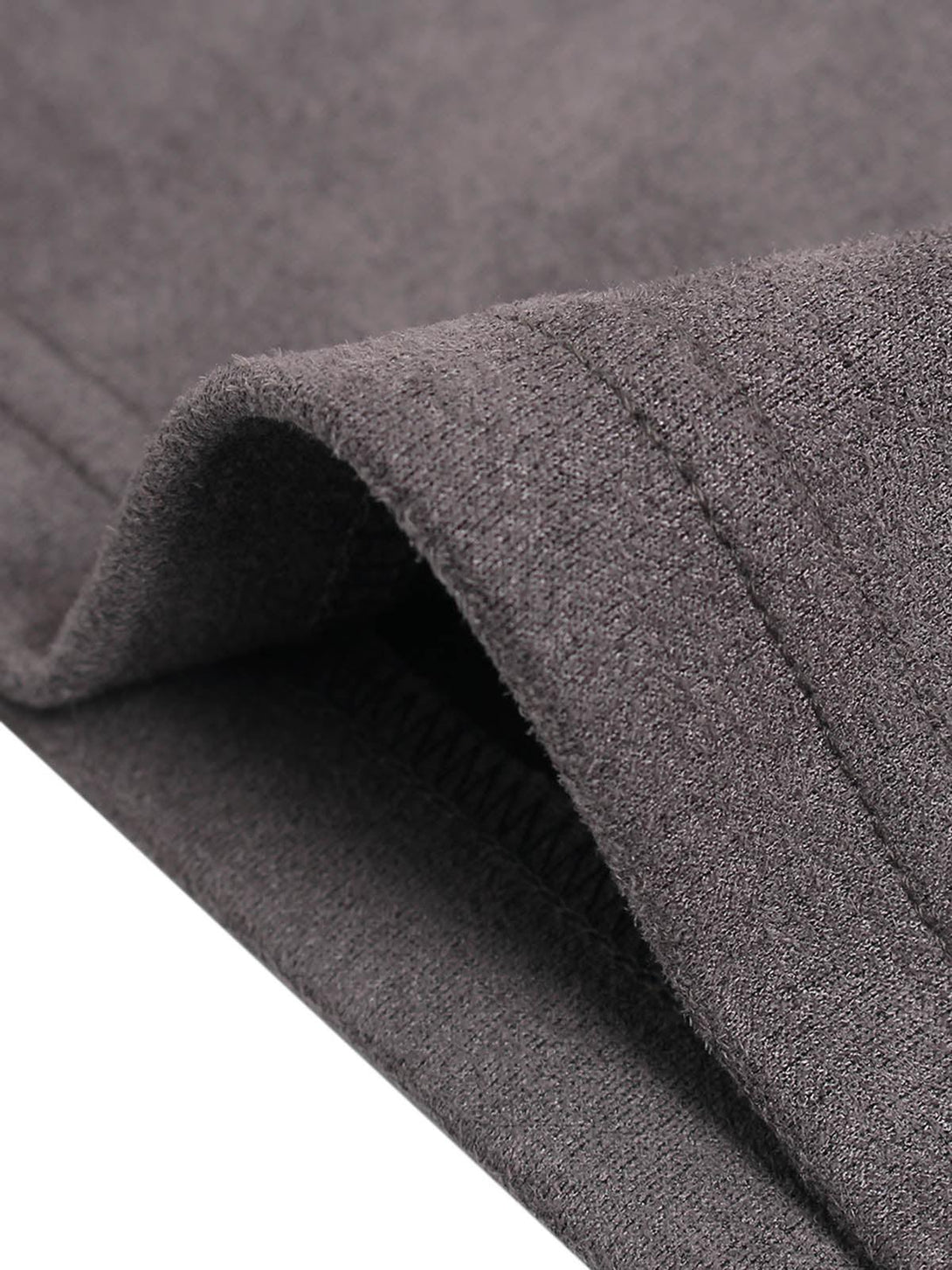 Detailed fabric and stitching on a TALISHKO T-shirt, highlighting contrast stitching design.