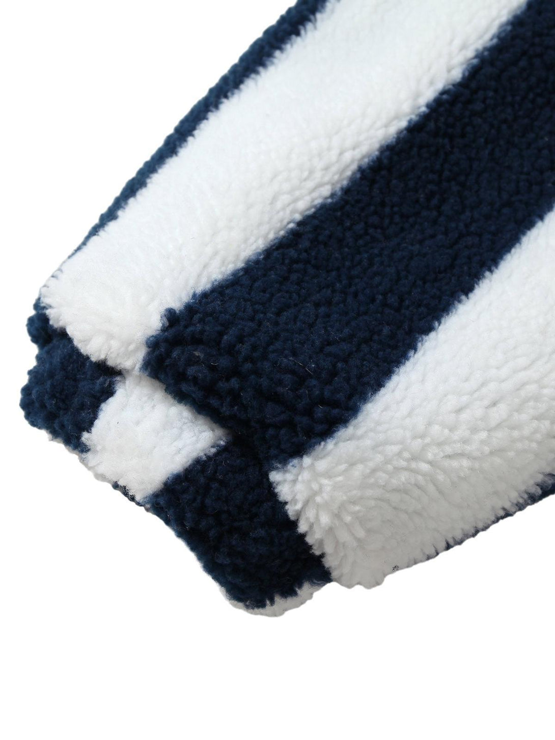 Striped sherpa sleeve detail by TALISHKO, highlighting soft texture and bold pattern contrast.