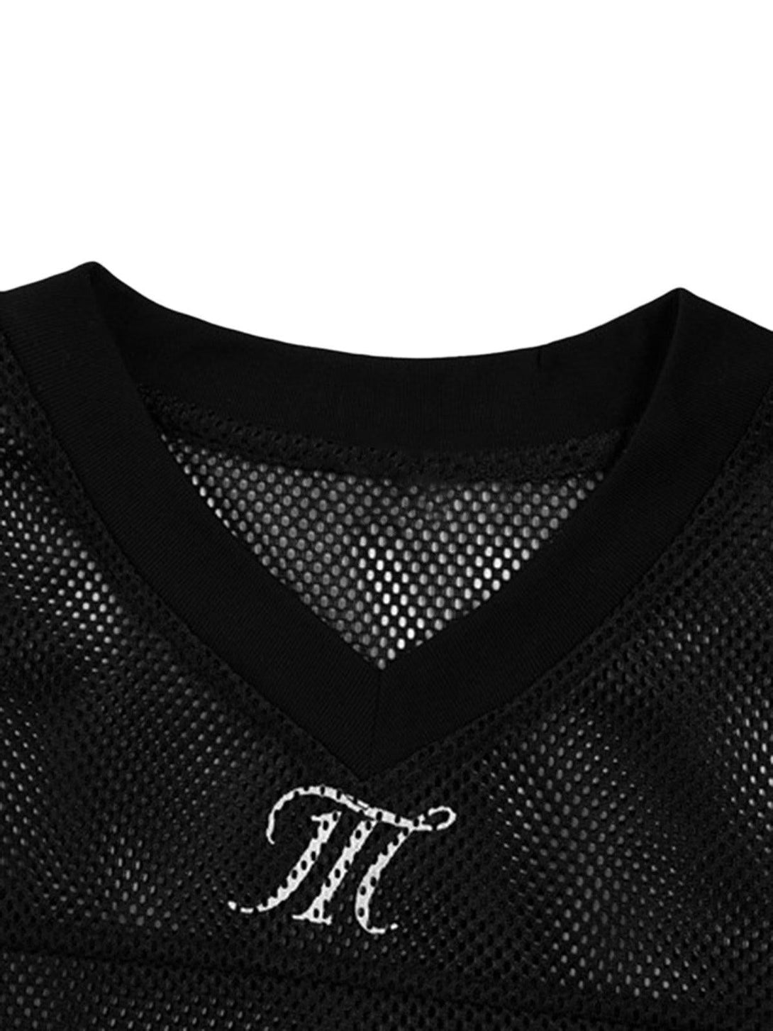 Detailed view of black mesh V-neck by TALISHKO, featuring stylish letter embroidery.