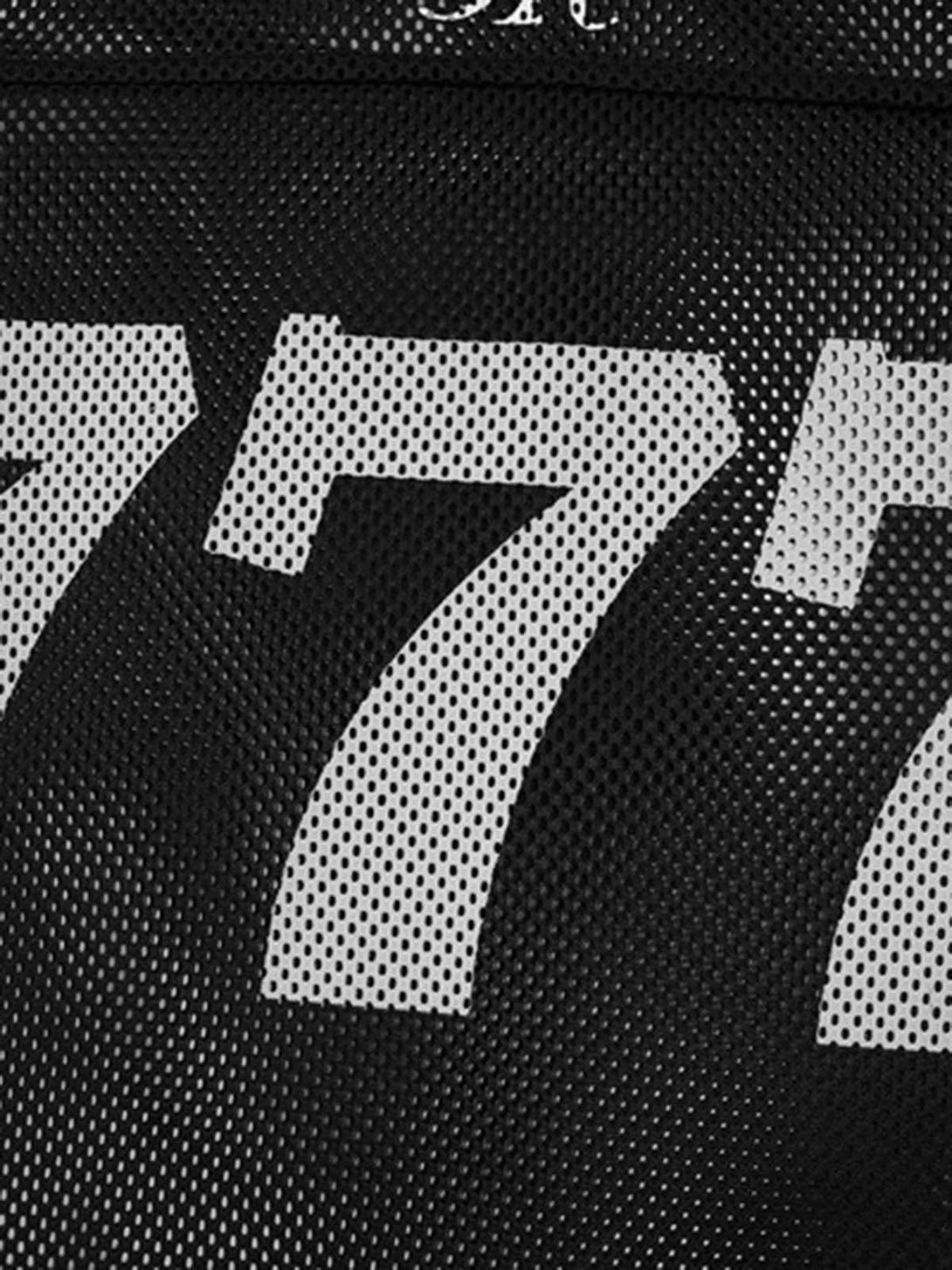 Close-up of bold "777" print on black mesh fabric by TALISHKO, showcasing sporty texture.