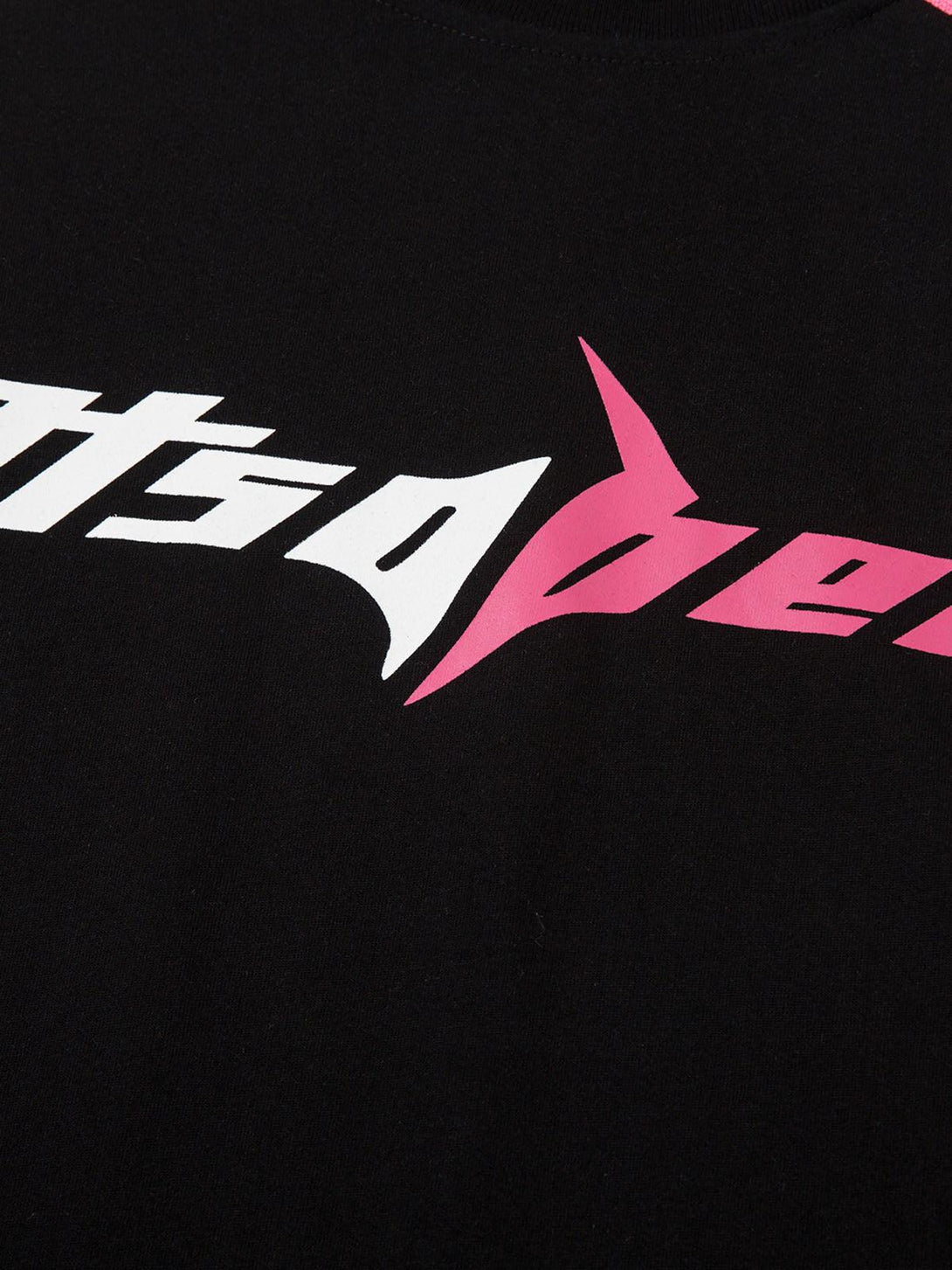Intricate look at the TALISHKO jersey's bold pink and white graphic detail on black fabric.