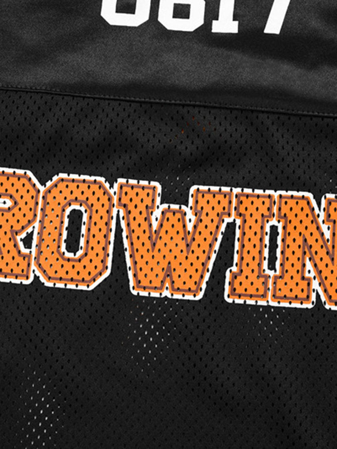 A close-up of TALISHKO's oversized jersey T-shirt, highlighting bright orange "ROWING" lettering.