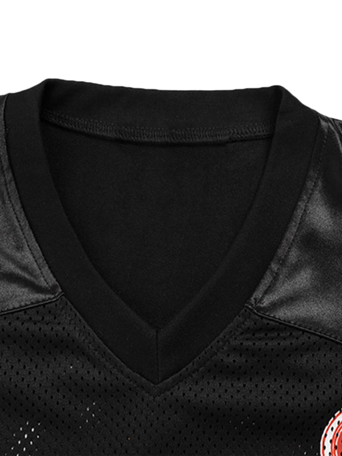 A detailed view of TALISHKO's V-neck design on a black jersey T-shirt, highlighting texture.