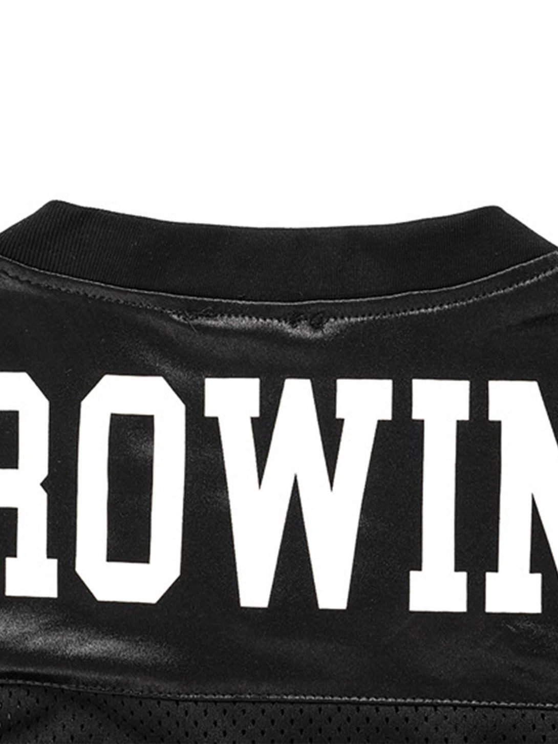 Detailed view of the "GROWING" print on the back of TALISHKO's black jersey T-shirt.