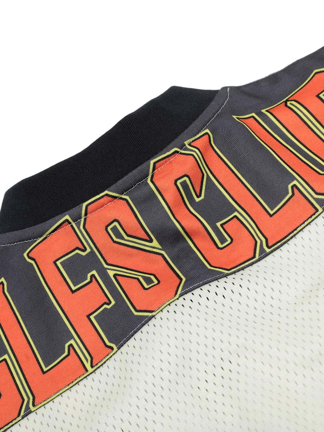 Detailed view of the bold lettering on a jersey-style T-shirt by TALISHKO.