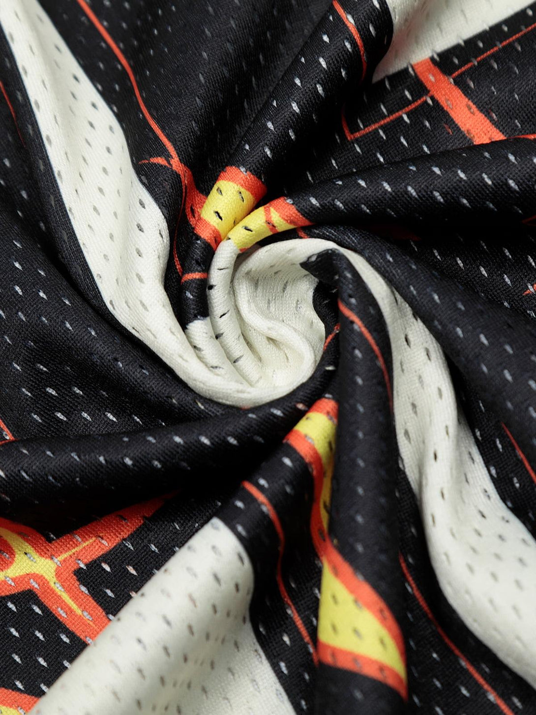 Intricate look at the flame print fabric of a jersey-style T-shirt by TALISHKO.