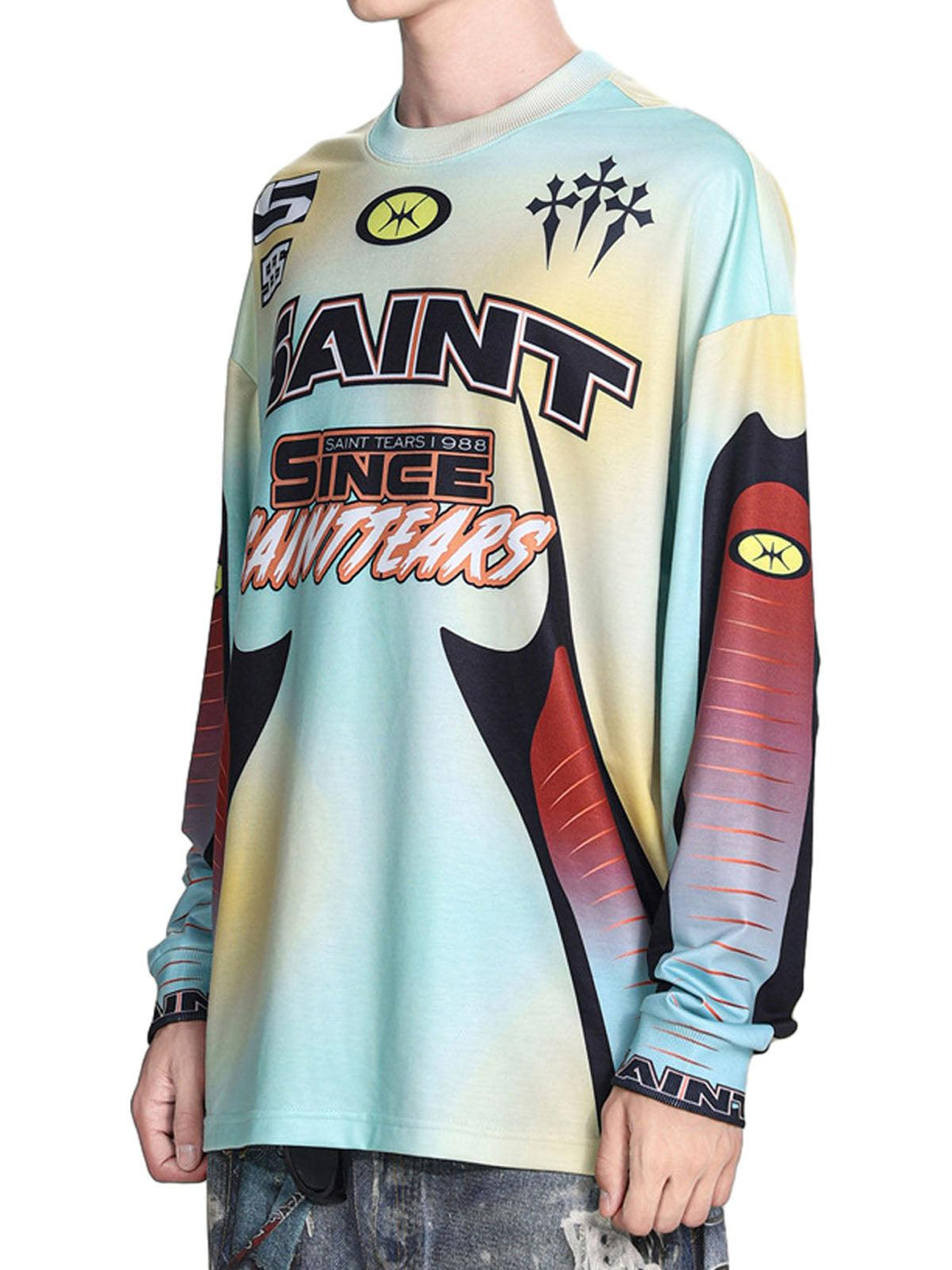 Model wearing TALISHKO's vibrant tie-dye long-sleeve jersey, showcasing unique graphic prints.