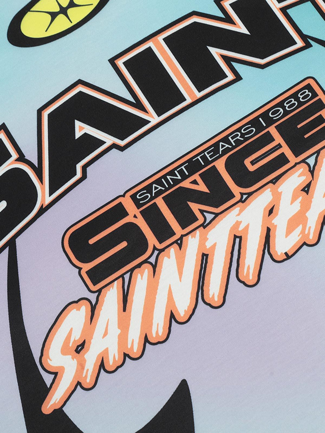 Graphic detail on TALISHKO's tie-dye jersey long-sleeve T-shirt, highlighting bold typography.