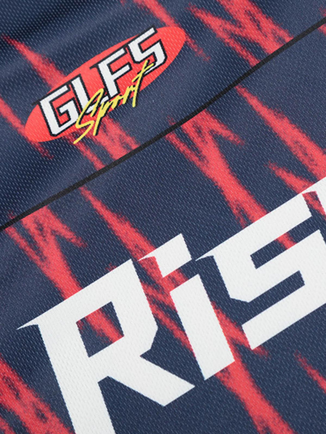 Intricate look at the TALISHKO jersey's logo and bold red pattern on navy fabric.