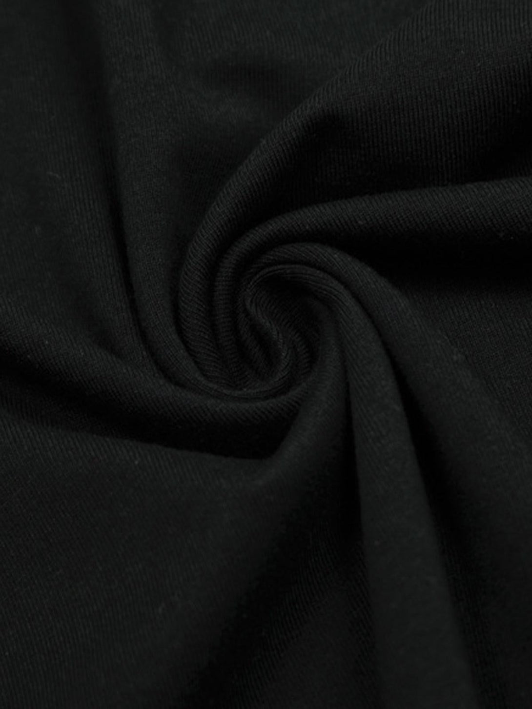 Zoomed-in texture of TALISHKO Jesus graphic T-shirt, showcasing soft black fabric detail.