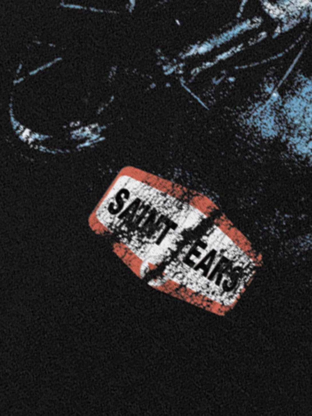 Close-up of TALISHKO Jesus graphic T-shirt showing "SAINTTEARS" detail on black fabric.