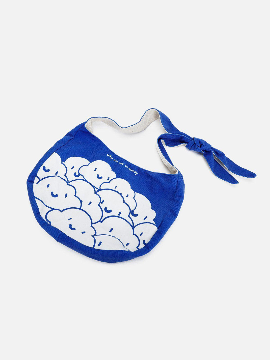 Blue canvas bag by TALISHKO with cute cloud design and knotted strap, perfect for a playful look.