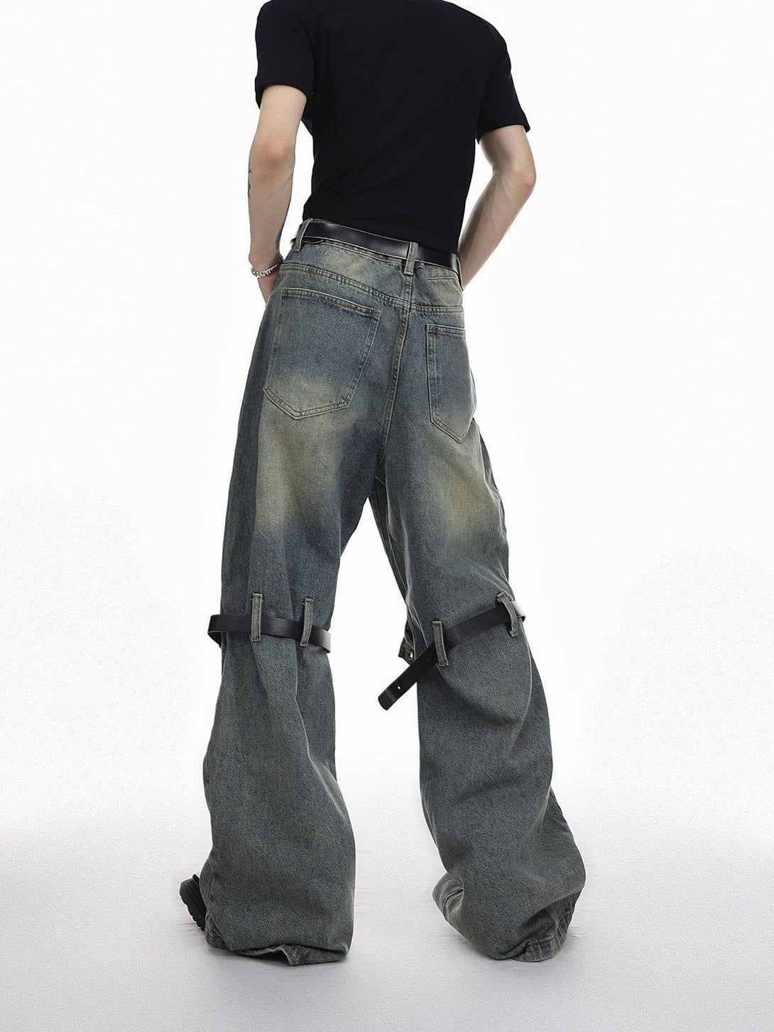 Back view of TALISHKO knee belt loose jeans highlighting unique and bold streetwear style.